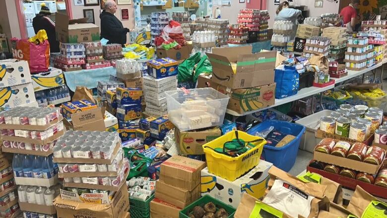 A small room is filled with boxes and boxes of food at a Nova Scotia food bank.