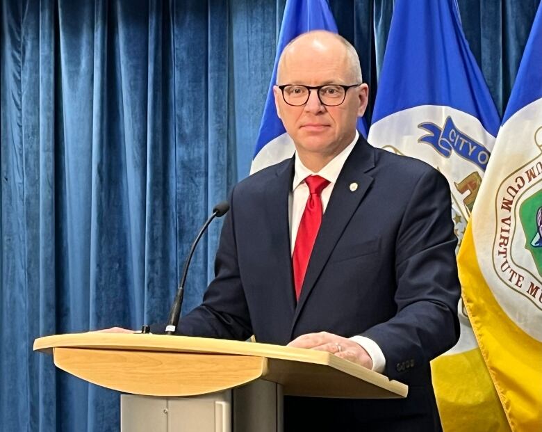 Winnipeg's mayor, standing at a podium.