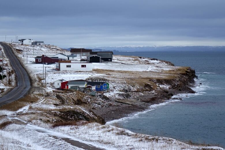 Houses by the shoreline in Felix Cove.