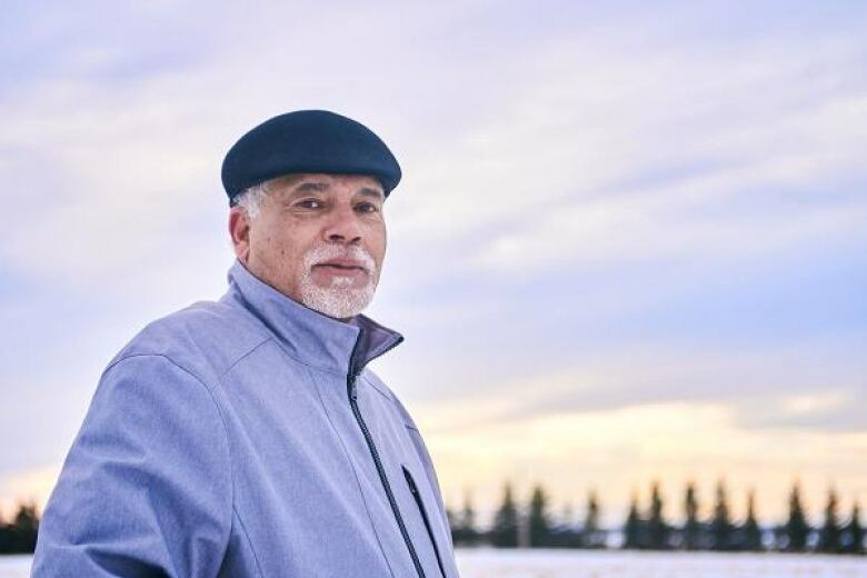 man in hat and coat outside