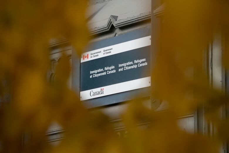 A building closeup with a sign that reads 'Immigration, Refugees, Citizenship Canada.'