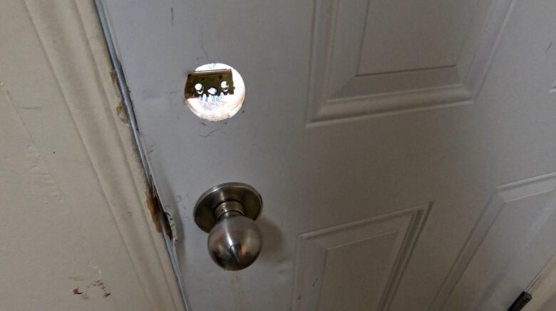 A closer look of a broken door lock.