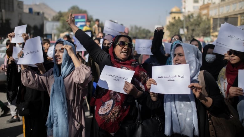 Afghan women chant during a protest in Kabul, Afghanistan on Thursday, Oct. 21, 2021.