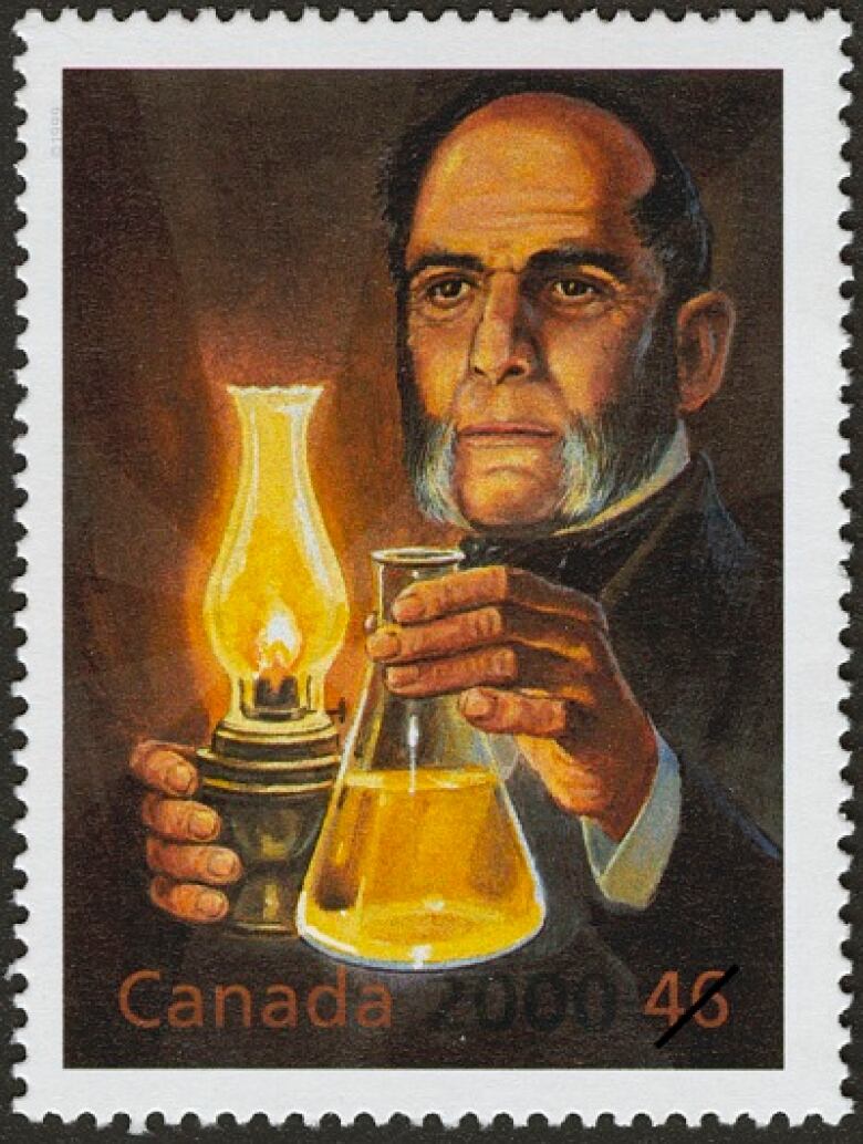 stamp depicting Abraham Gesner holding kerosene lamp