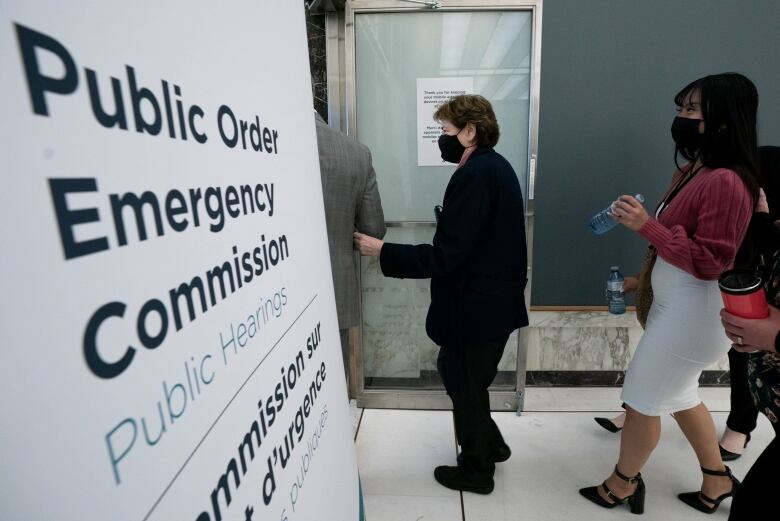 Zexi Li and Victoria de la Ronde arrive to testify at the Public Order Emergency Commission in Ottawa on Oct. 14, 2022.