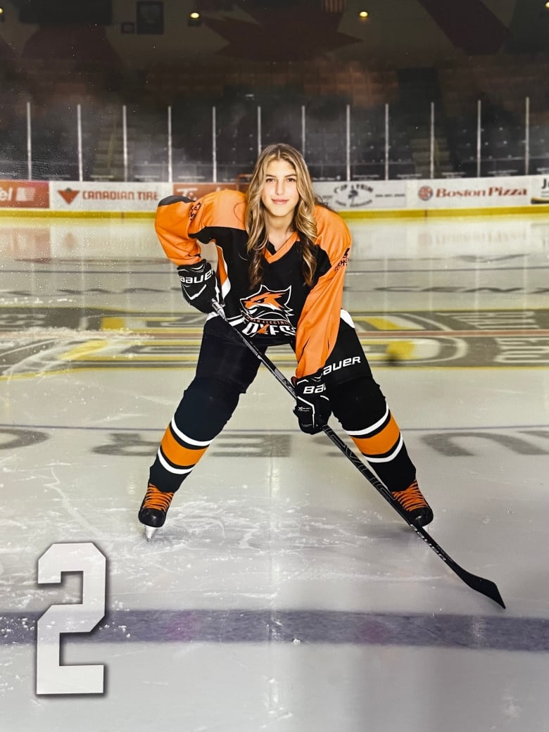 Female hockey player on ice 