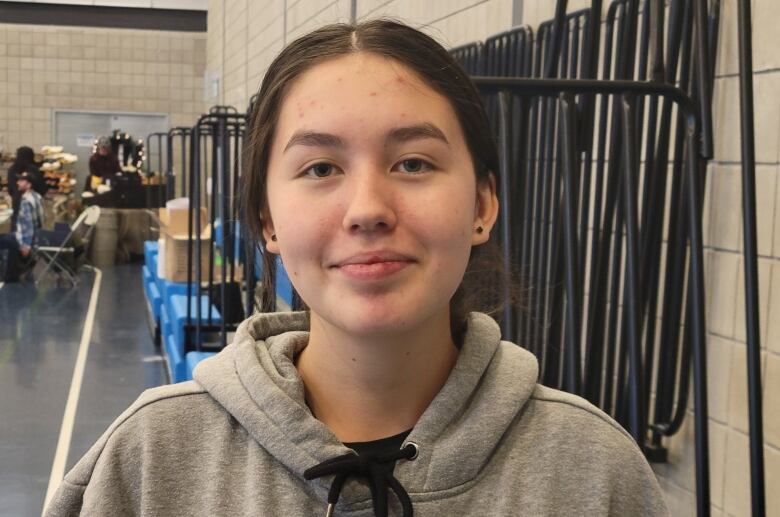 Portrait taken in a gymnasium.