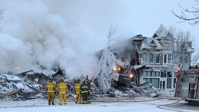 Steam rises from the site of where a building used to sit.