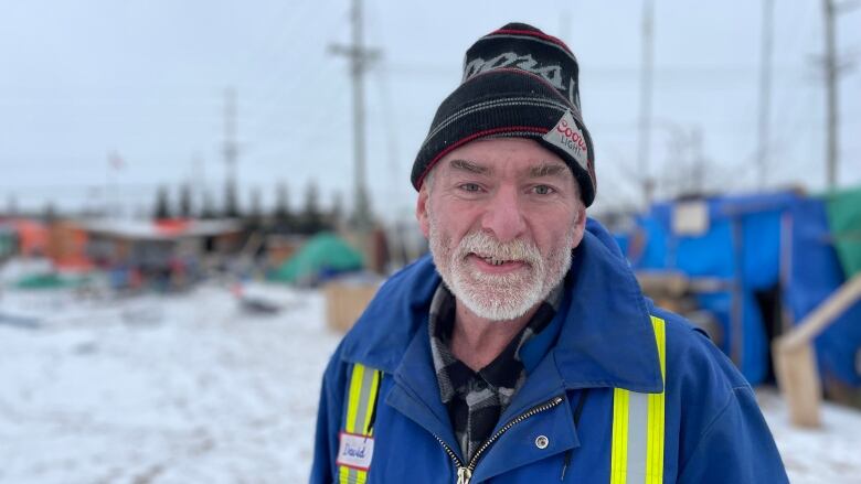 Dave MacDonald stands in front of the encampment at the Charlottetown Event Grounds.