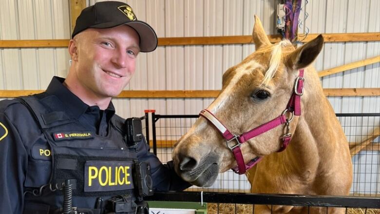 OPP Const. Grzegorz Pierzchal with a horse.