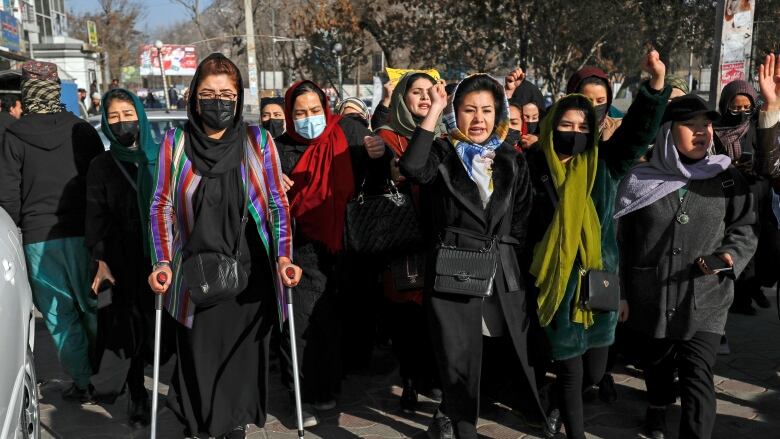 Afghans protest against the ban on university education for women in Afghanistan. 