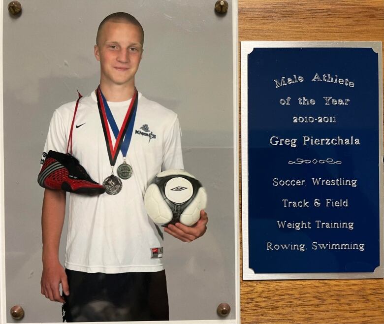 A young Grzegorz Pierzchala smiles, wearing two medals and holding a ball. 