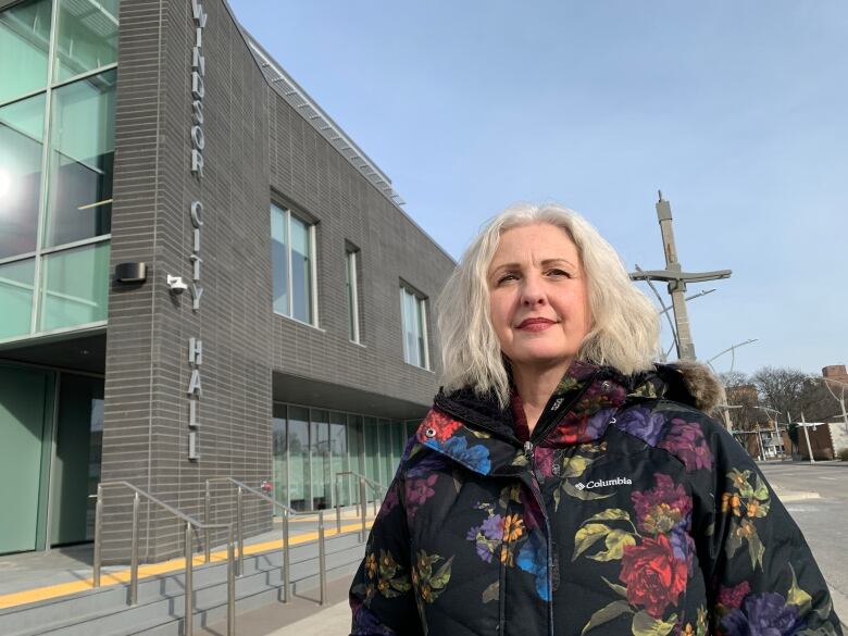 Woman stands outside of Windsor City Hall