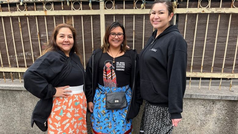 Three women in skirts