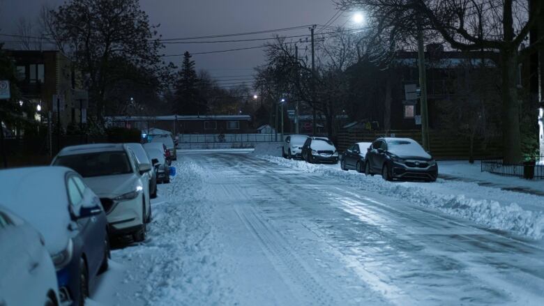 A road covered with a sheet of ice and snow. 