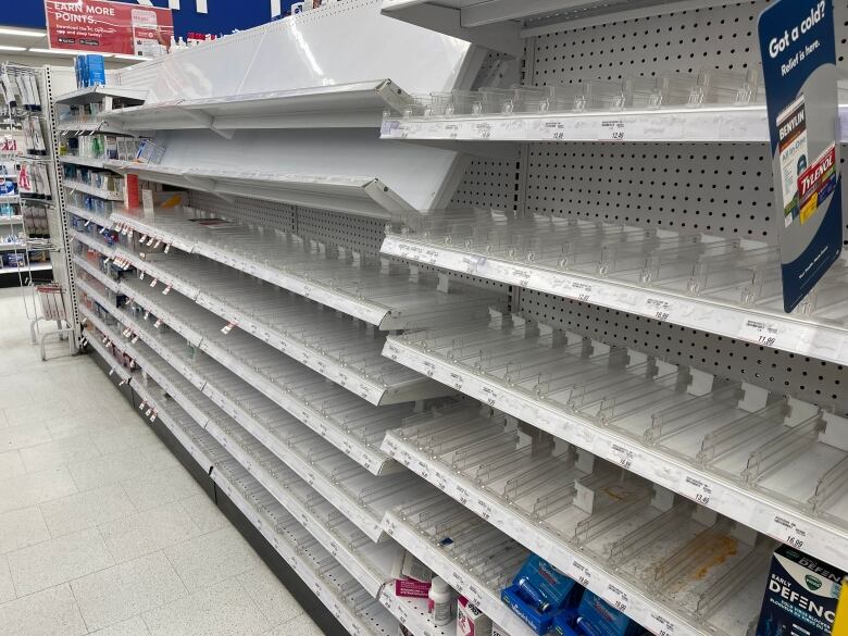 An empty stretch of shelf at a B.C. pharmacy that would normally be filled with adult cold and flu medication.