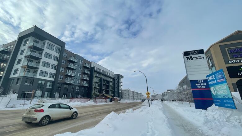 Snow piled on street.