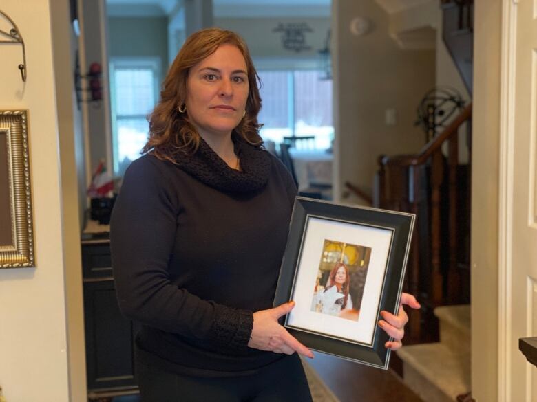 Denise Warriner says she's haunted by the scenes of her sister's final conscious moments alone with guards at Toronto General Hopsital in May 2020. 