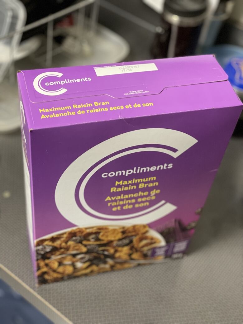 A purple cereal box, with the top 'best-before' date shown.