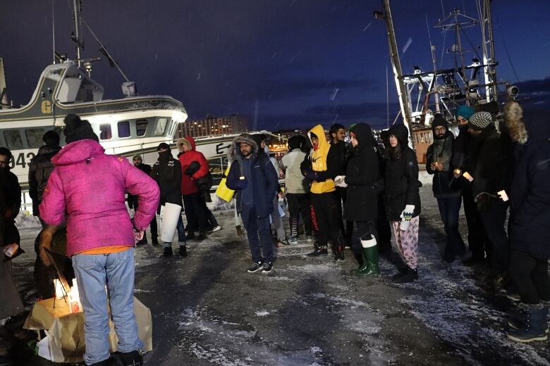 Students gathered in front of a ship on Sydney waterfront.