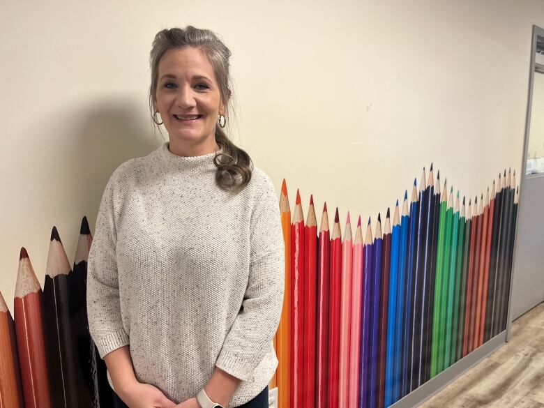 Woman standing in hallway of BGC Prince County in Summerside, P.E.I. 