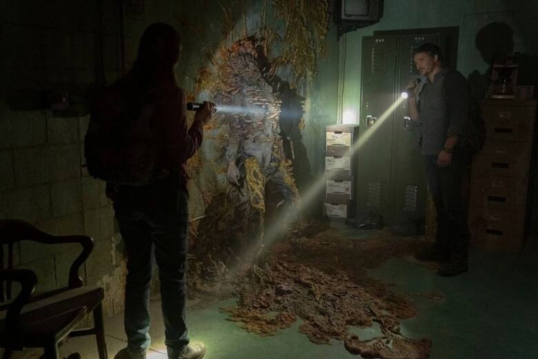 Anna Torv and Pedro Pascal shine flashlights in season 1, episode 1 of HBO's The Last of Us.