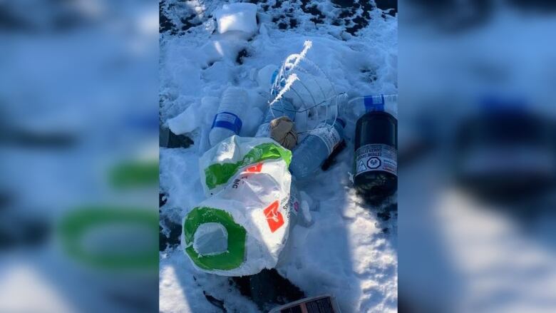 Garbage is seen on snow.