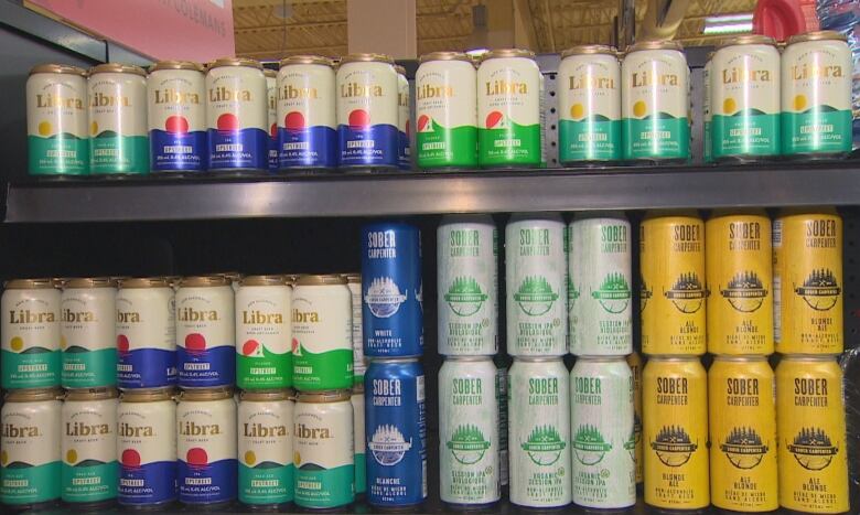 Shelves full of cans of non-alcoholic beer 