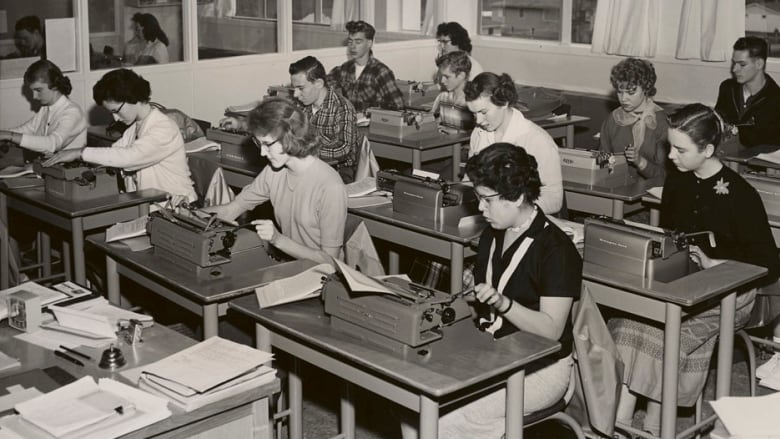 Students seated at their classroom desks.