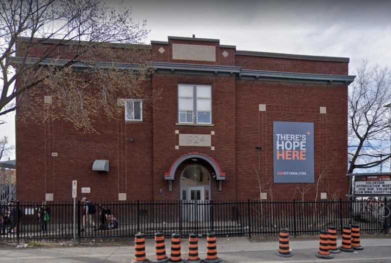 exterior shot of three story brick building on a downtown corner