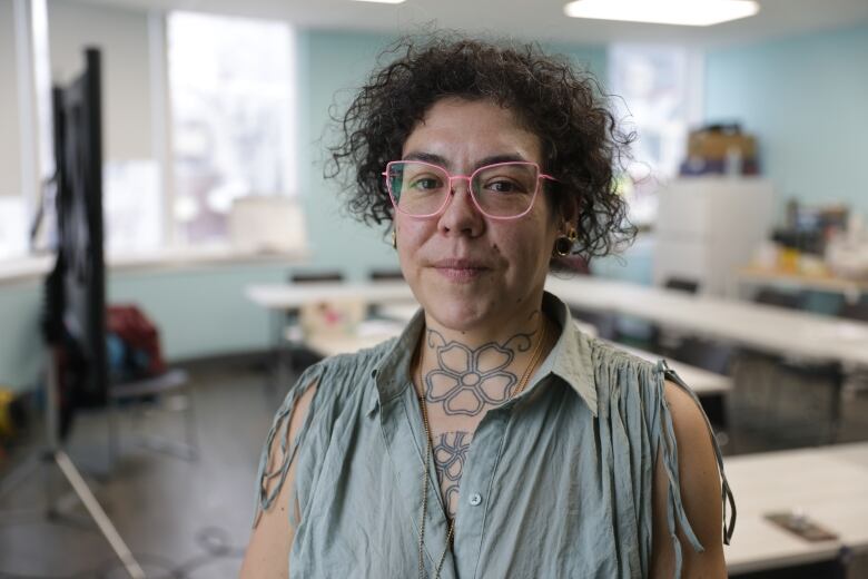 Stacey Fayant, wearing pink glasses at the Newo Yotina Friendship Centre