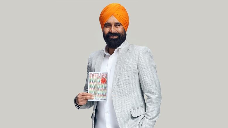 A book cover featuring the word HOTLINE repeated in orange, red, yellow and green type and a photo of a Sikh man in a turban sitting in the woods in the snow smiling happily.