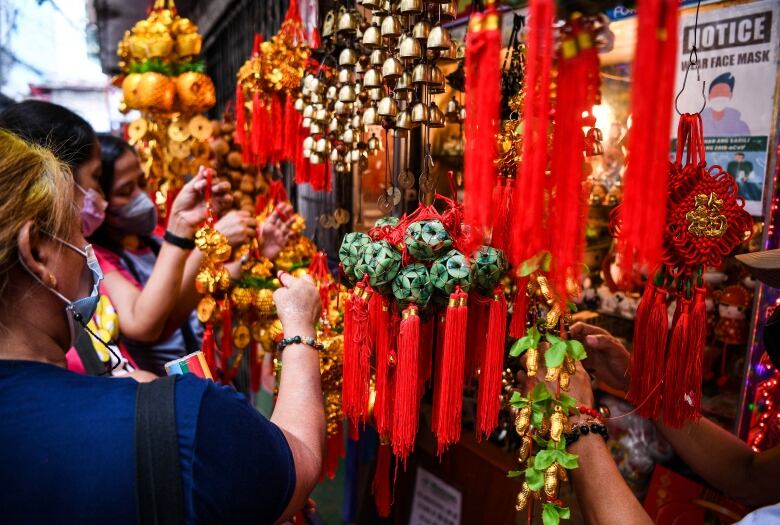 Shoppers browse for ornaments at a shop in Manila's Chinatown ahead of Lunar New Year.