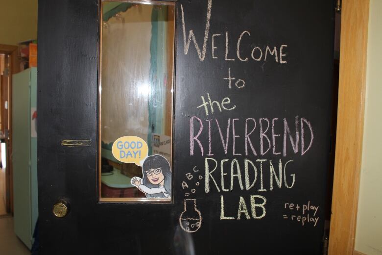 picture of a black classroom door that says 'Welcome to the Riverbend Reading Lab