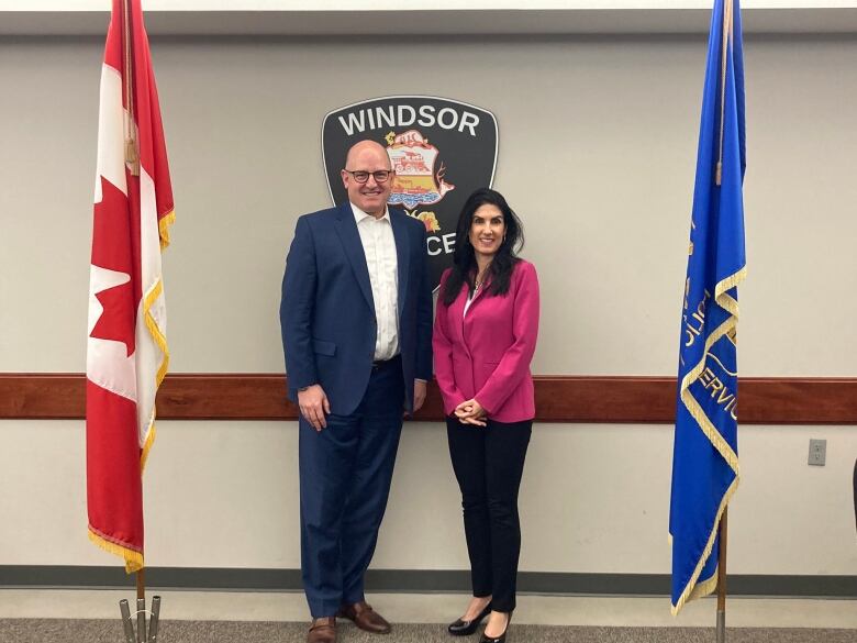 Drew and Sophia stand together in front of a Windsor police sign.