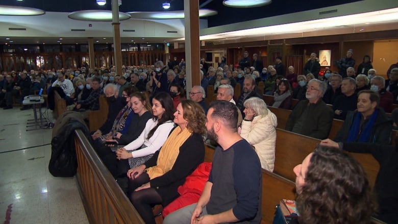 People crowded into pews