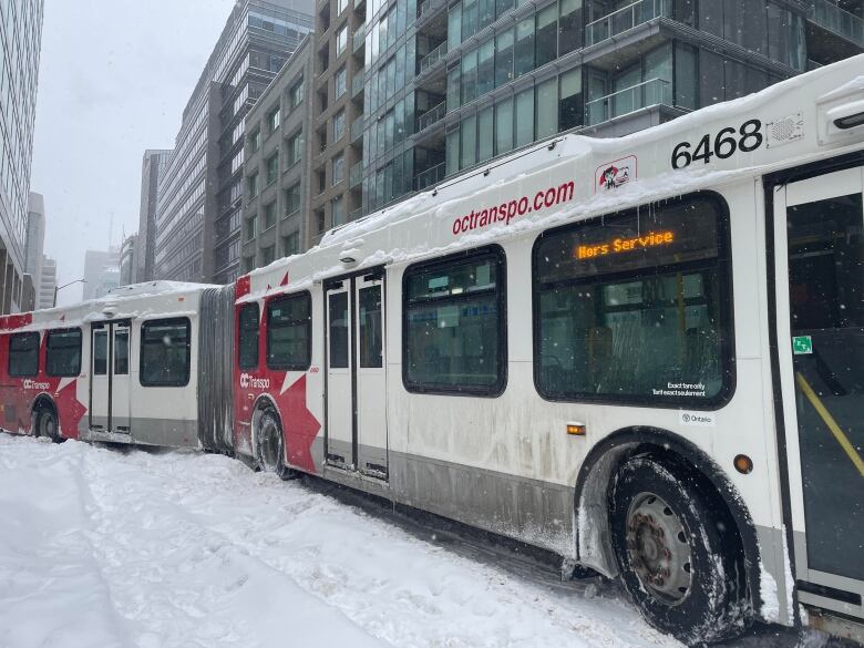 bus stuck in snow on the road