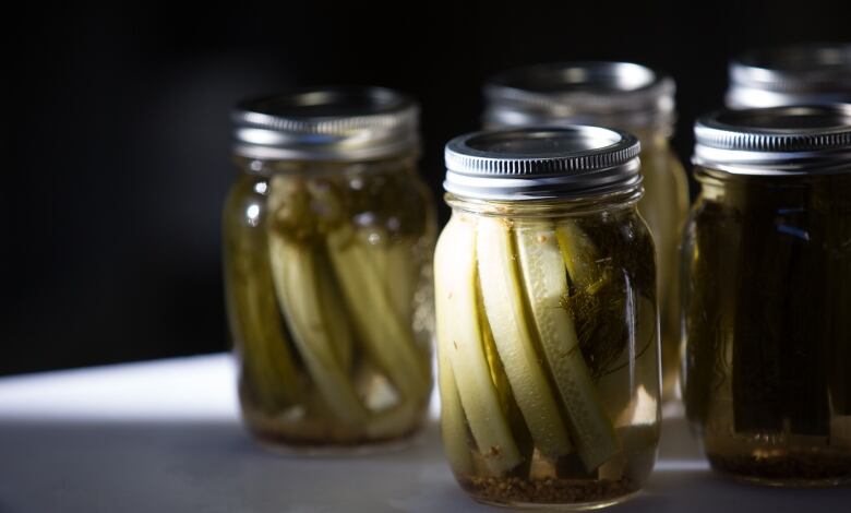 Jars of pickles on a counter