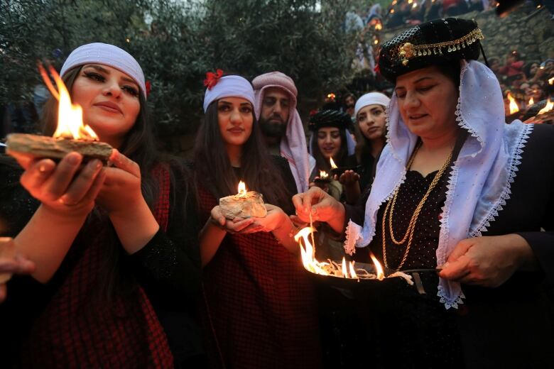 Iraqi Yazidis light candles and paraffin torches during a ceremony to celebrate the Yazidi New Year in Duhok province, Iraq April 16, 2019. Yazidis' ancient monotheistic religion made them a target for the Islamic State, which labelled them 