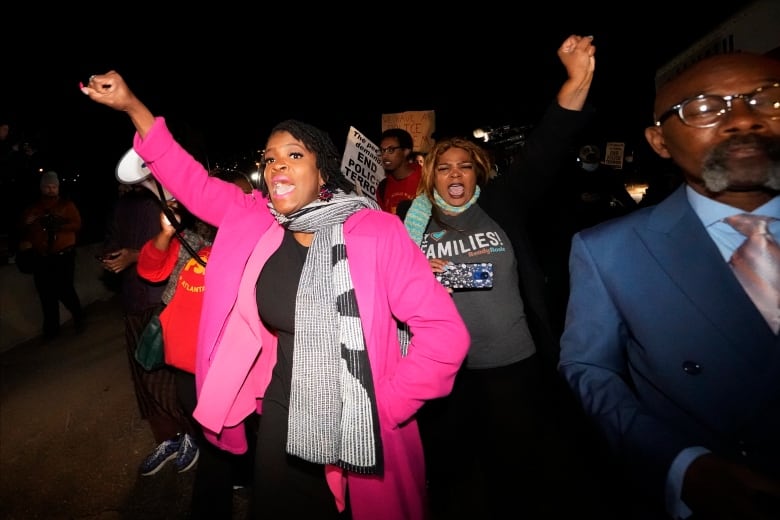 Protesters march down a Memphis street. 