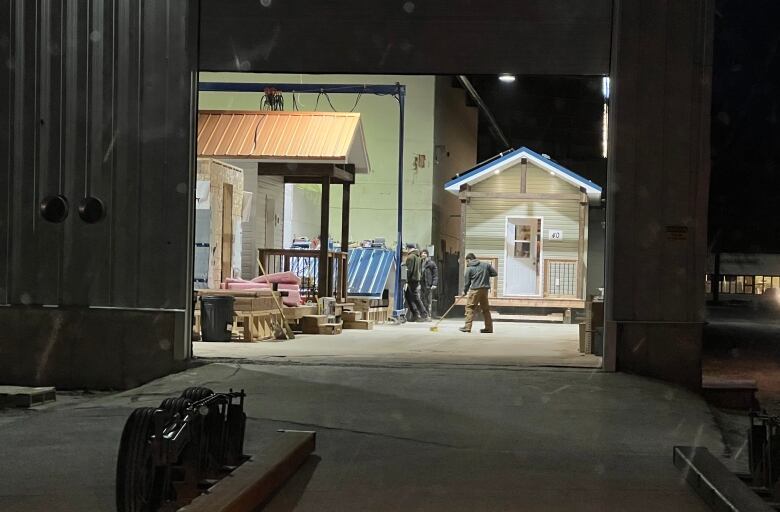 A view through a large warehouse door.