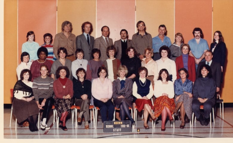 Staff portrait from the 1983-1984 school year featuring Millie Burgess