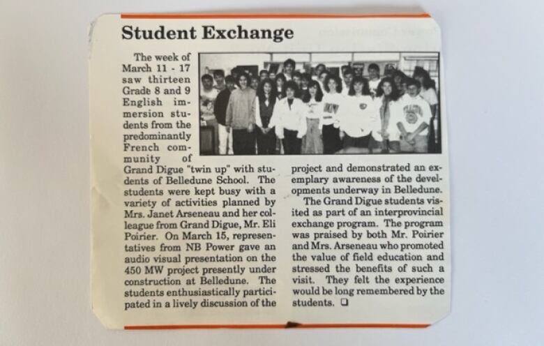 A newspaper clipping with the headline Student Exchange and a black-and-white group photo in the upper right corner.