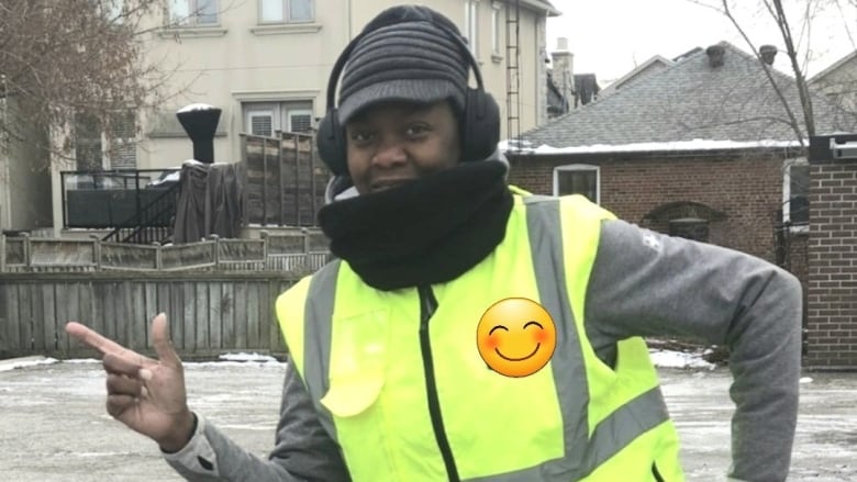 Mischelle is shown wearing her bright yellow crossing guard vest, striking a dancing pose.