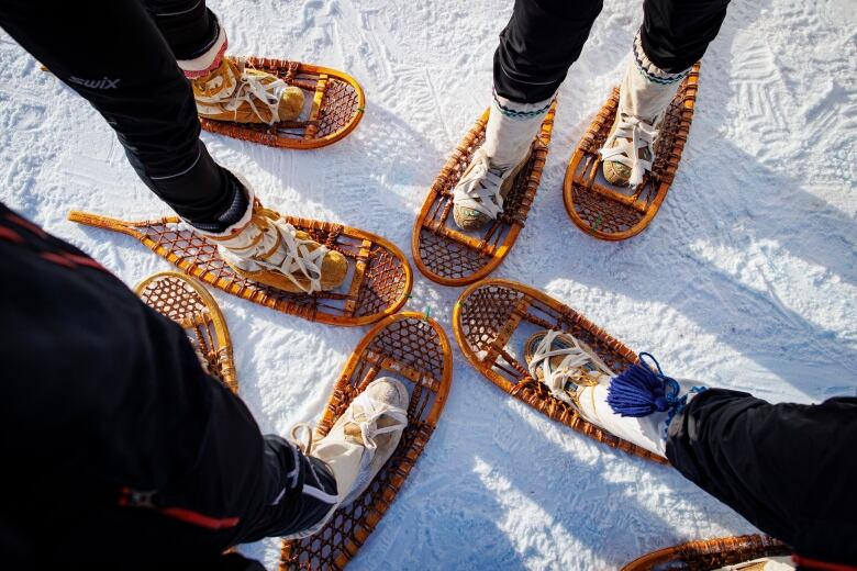 Team Yukon members show off their snowshoes.