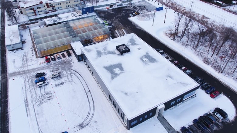 Arial view of factory with greenhouses