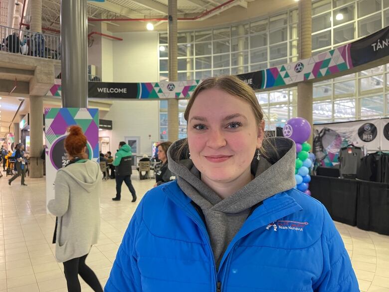 Girl in hockey arena.