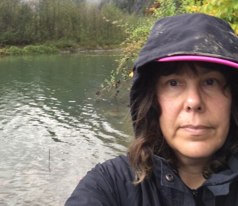 Kerrie Charnley standing beside Upper Pitt River