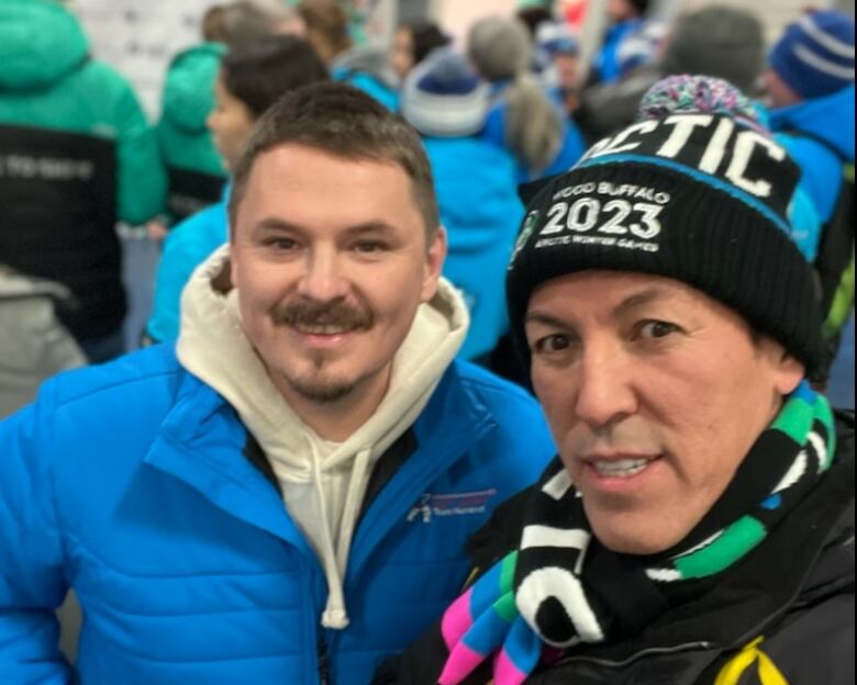 Two smiling men in a selfie.