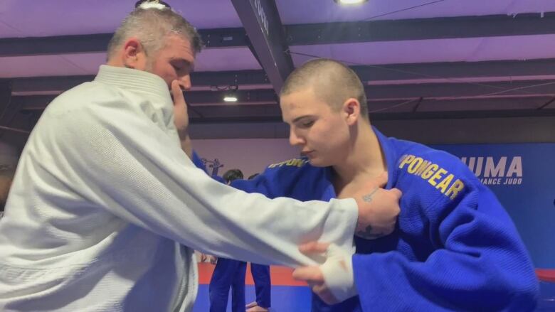 Two Judokas face off during training. 